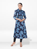 Woman wearing a blue floral dress on a white background
