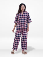 Woman wearing a plaid Three-Quarter pajama set on a white background