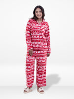 Woman wearing a red and white patterned onesie on a white background