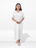 Woman wearing a white dress with a collar on a white background