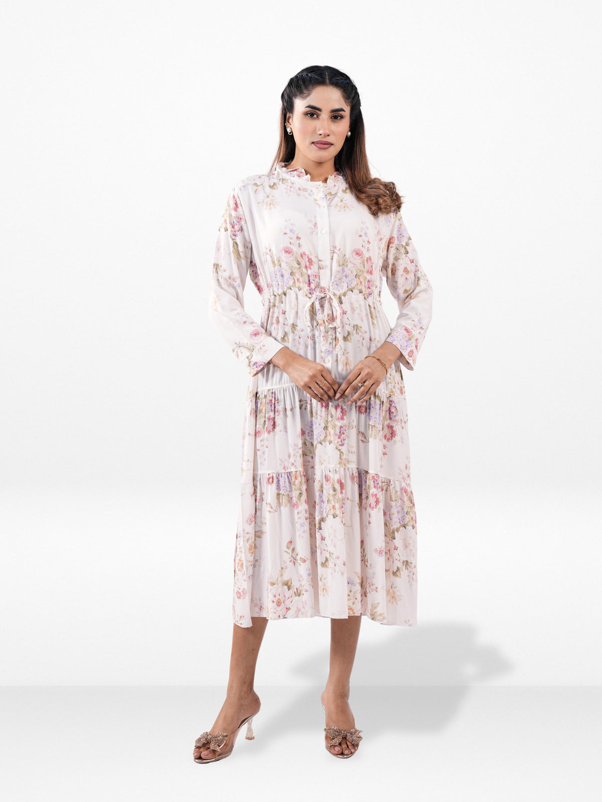 Woman wearing a floral dress on a white background