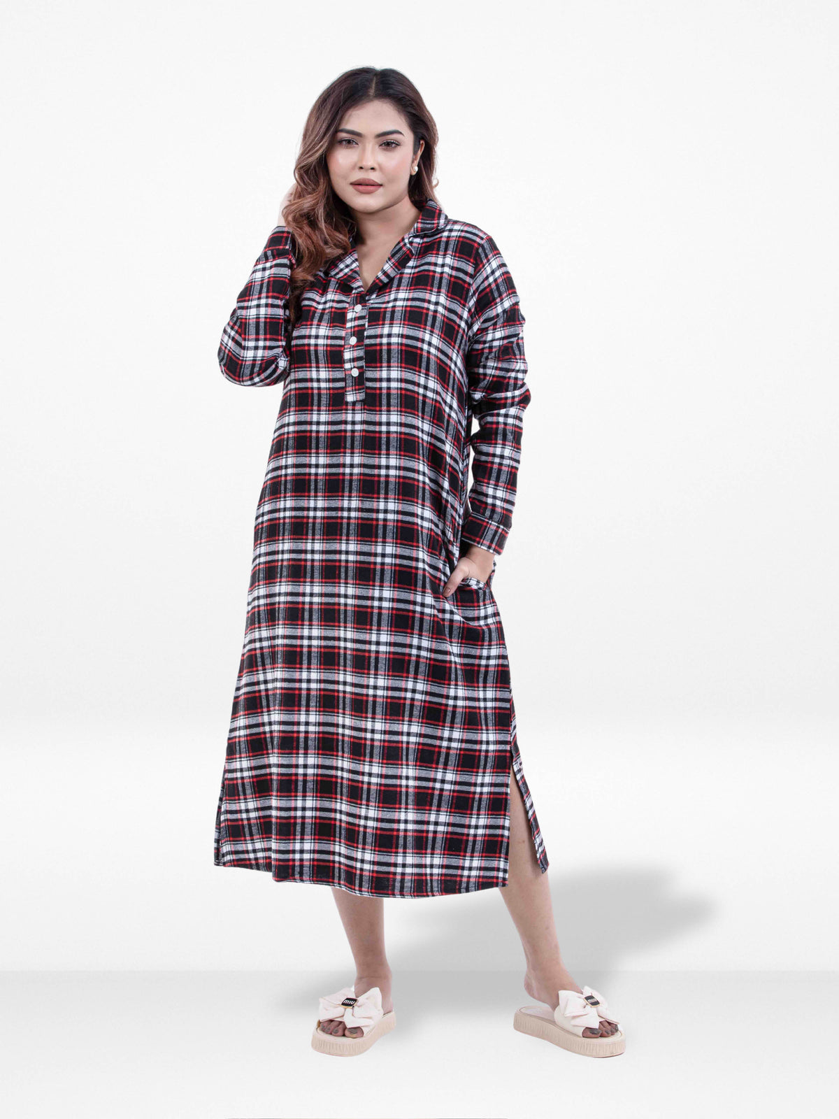 Woman wearing a plaid dress on a white background