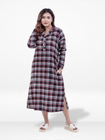 Woman wearing a plaid dress on a white background