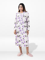 Woman wearing a floral nightgown on a white background