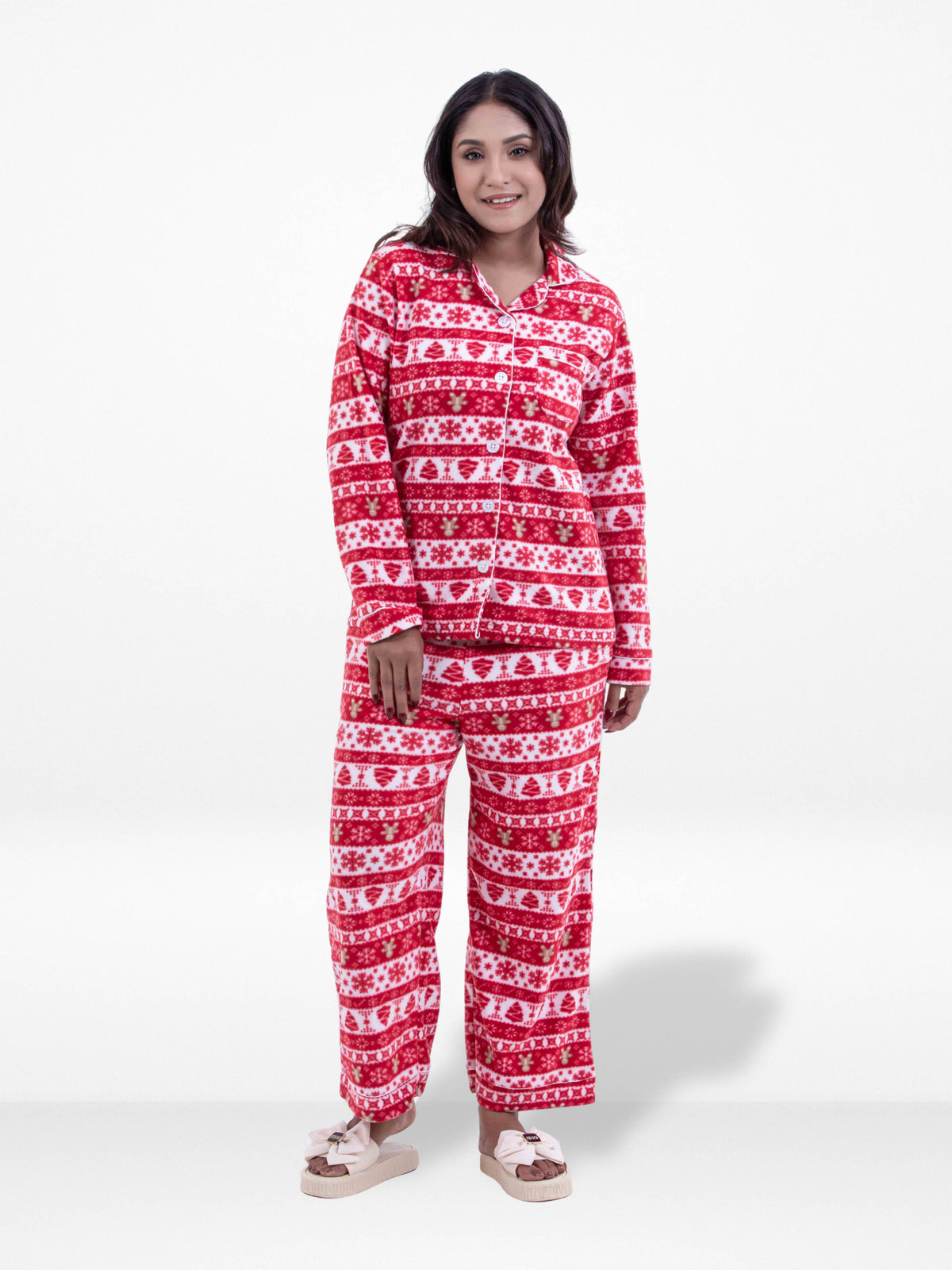 Woman wearing a red and white patterned onesie on a white background
