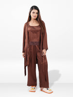 Woman wearing a brown outfit with a matching cardigan on a white background