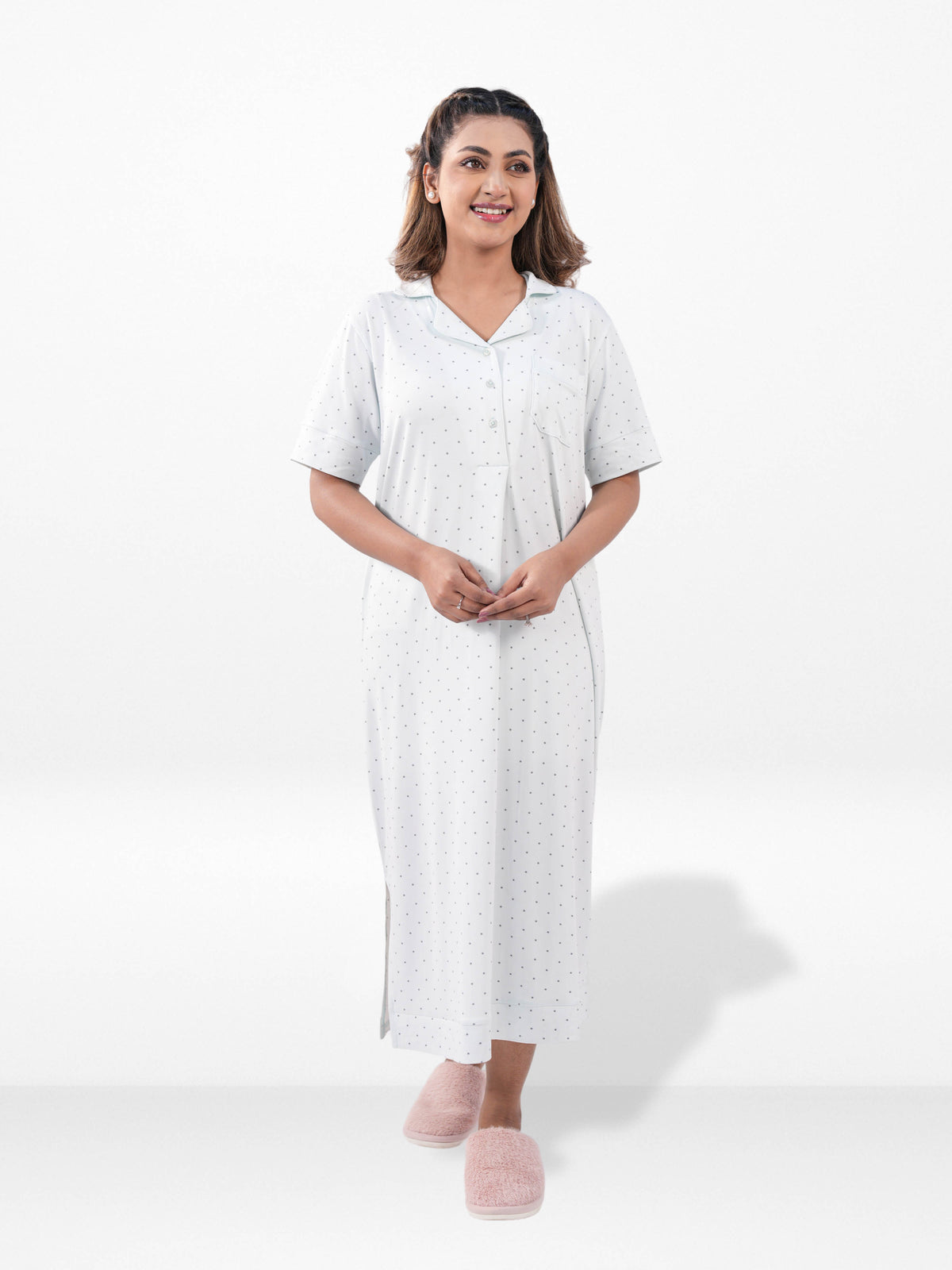 Woman wearing a white dress with a collar on a white background