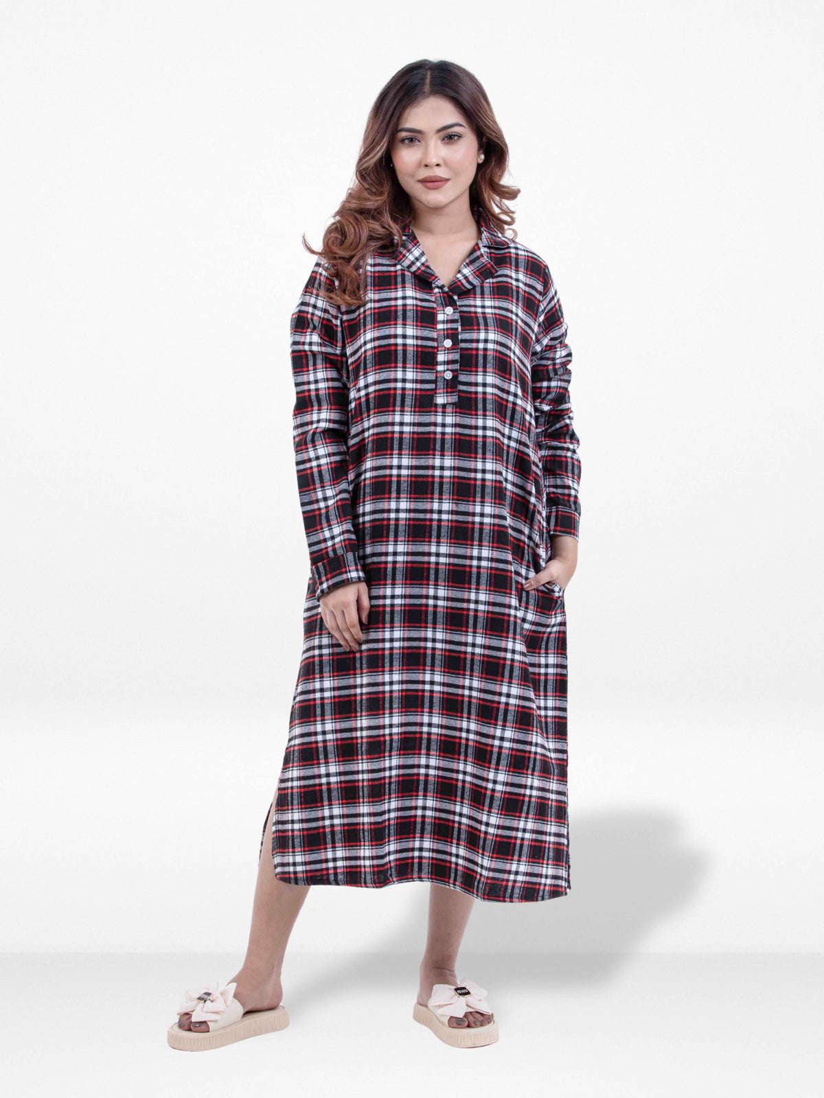 Woman wearing a plaid dress on a white background